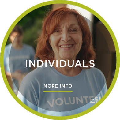 Photo of smiling lady with red hair in blue volunteer shirt with copy: Individuals