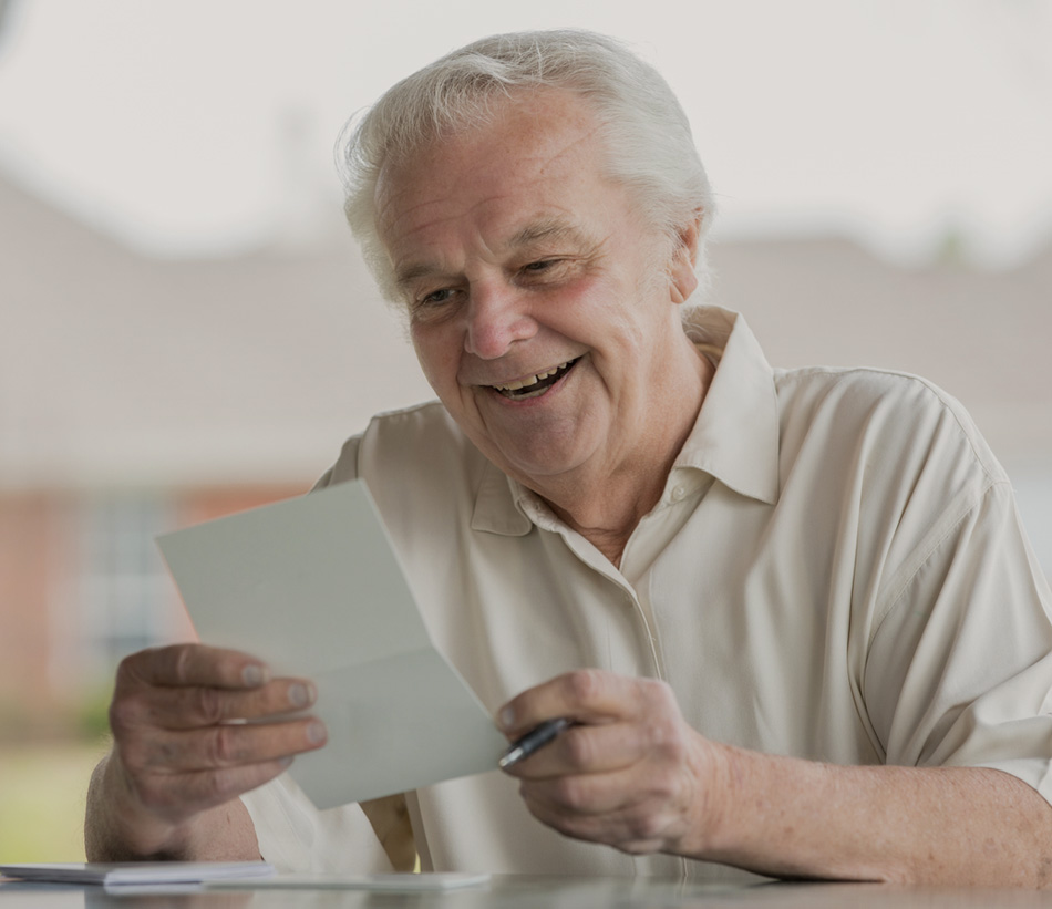 Male senior reading a letter