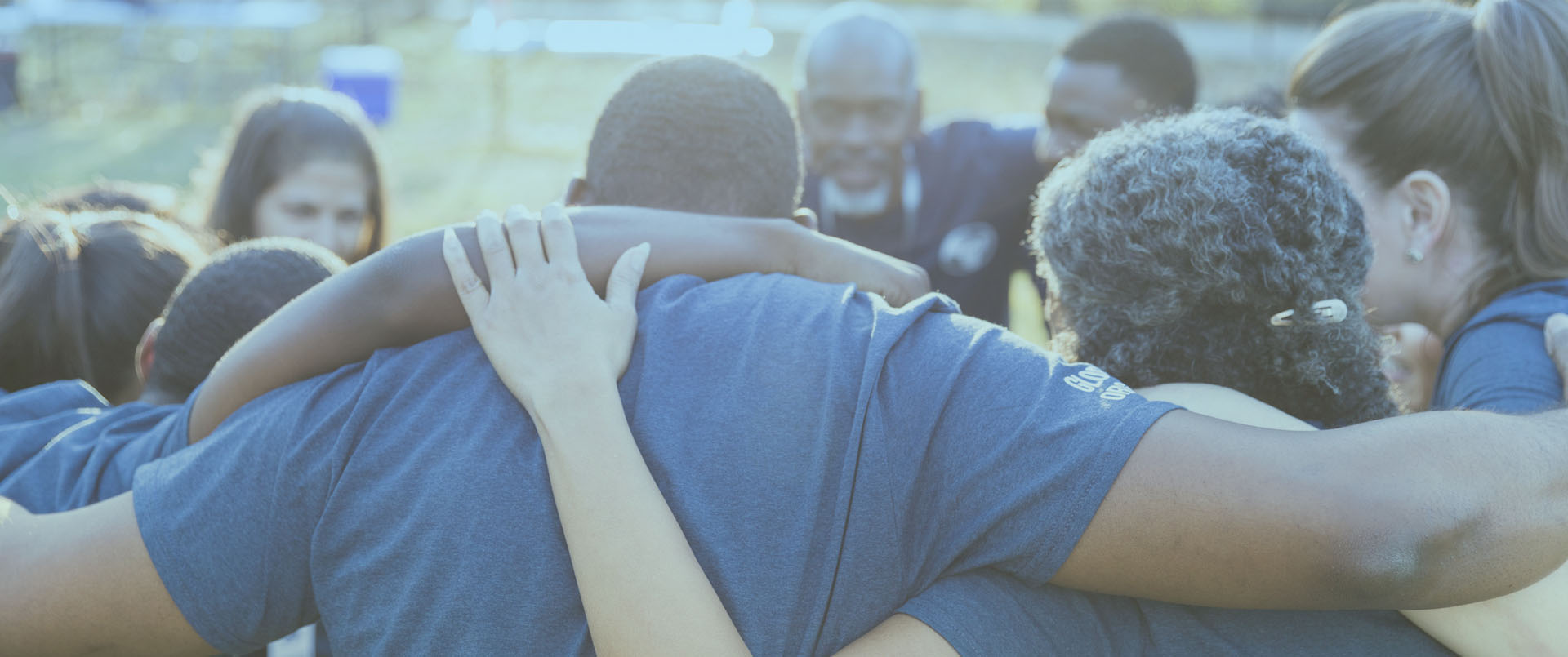 Volunteer team in huddle