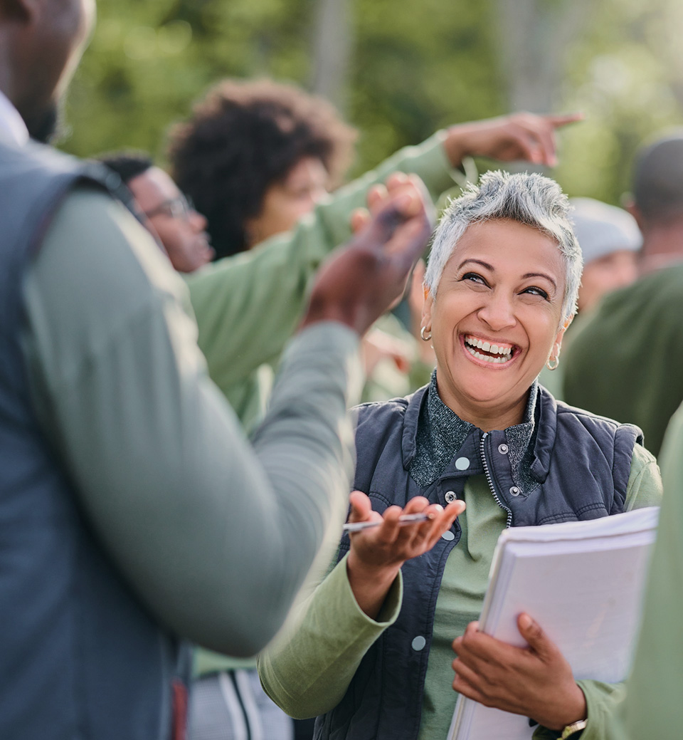 Volunteer laughing with other volunteer